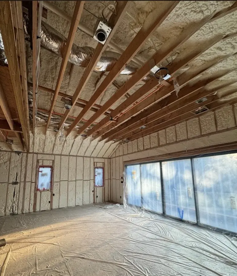 Interior walls and ceiling insulated with spray foam during new construction in Glenmont